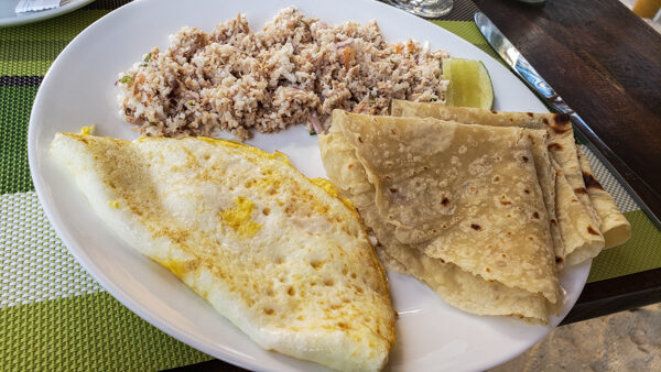 Maldivian breakfast of tuna, coconut, and chili with roti and egg