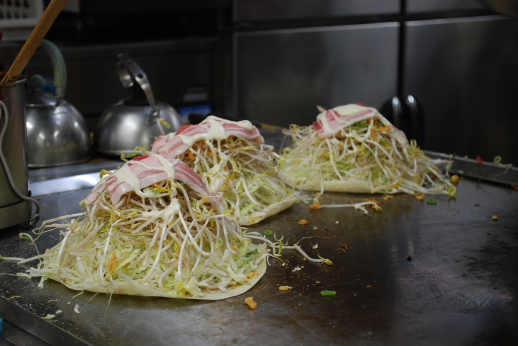 Hiroshima style Okonomiyaki Being Prepared Hiroshima style Okonomiyaki Being Prepared